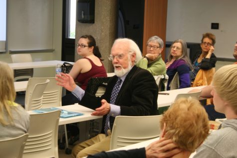 Shakespeare scholar and former UA professor William Williams enlightens the audience on the playwright's folios during the first presentation of Friday afternoon. 