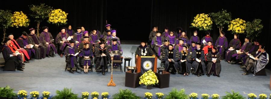 President Proenza stands before loved ones to give his last speech to law graduates.