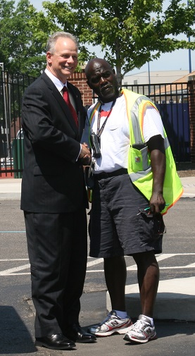 President Scott Scarborough greets a campus worker while touring the campus on Scarboroughs first day on campus.