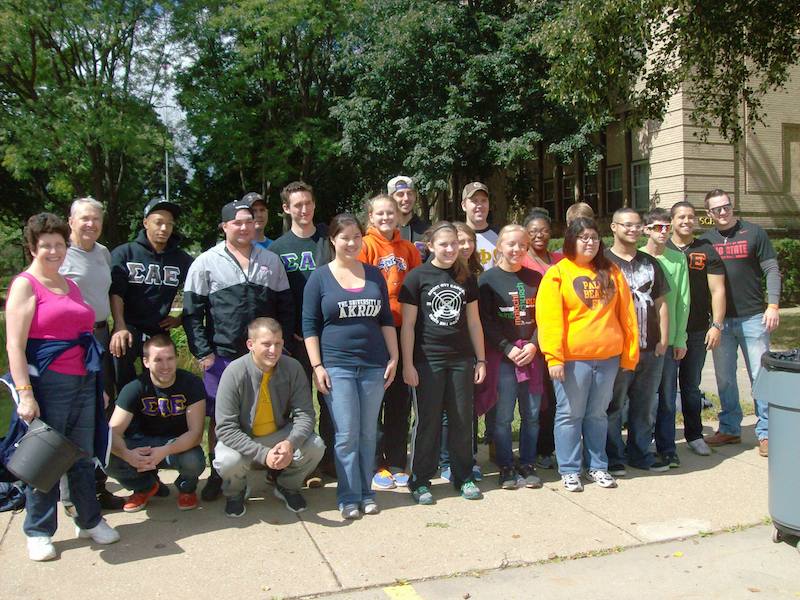 UAkrons ServeAkron volunteers pose for after a long day of yard work