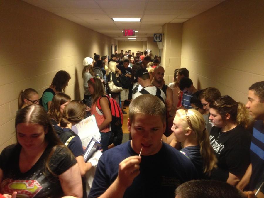 Students take shelter in the basement of the Student Union during a tornado warning.