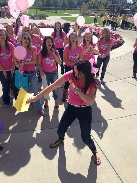 A Sorority member dances as they get new recruits