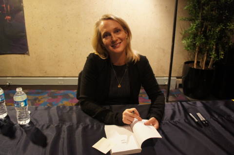 Author Piper Kerman signs books for fans in the lobby of EJ Thomas Hall.