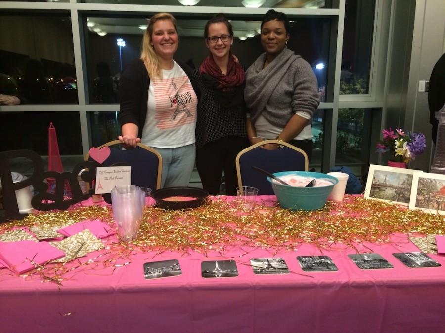 Jessie Bose, Emma Salzbrenner, and Essence Bradley from Off Campus Student Services and their Pink Parisian
