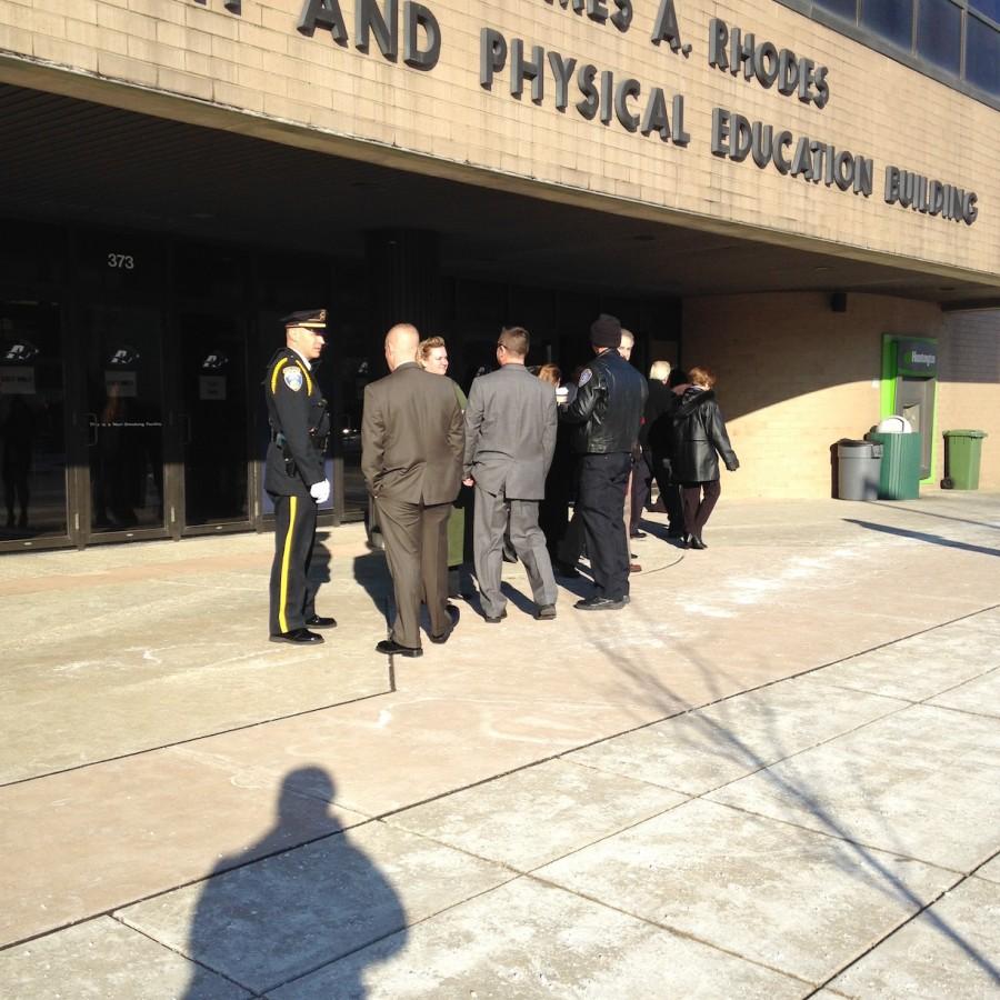 An officer monitors the line to get into the lobby of James A. Rhodes arena.