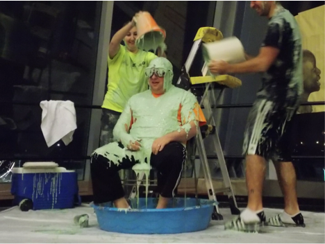 Zak Steiner, the first place winner of the event, is slimed by the second and third place winners.