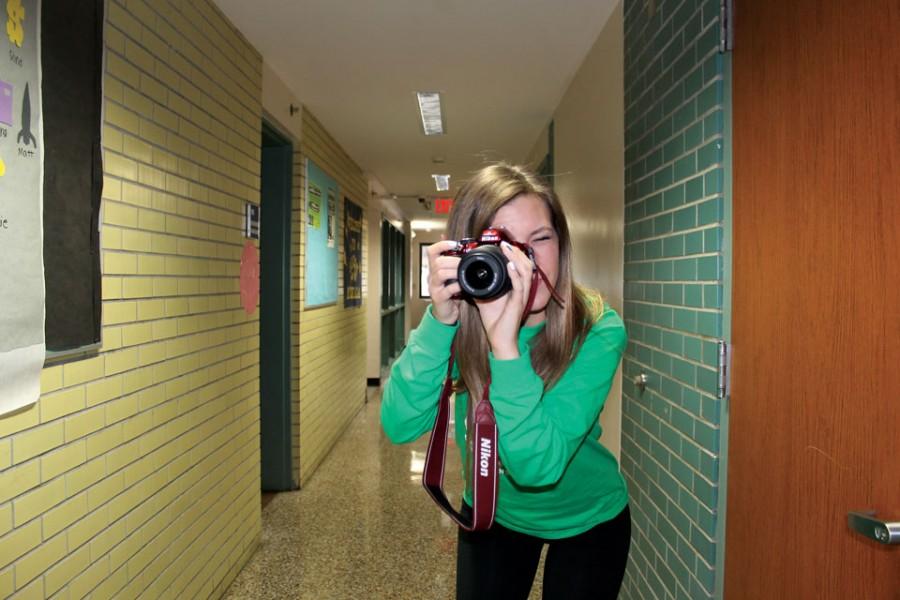UA student Cat Fisher preparing to take a photograph.
