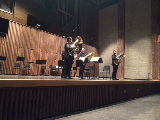 Performers play tuba on Guzzetta stage.