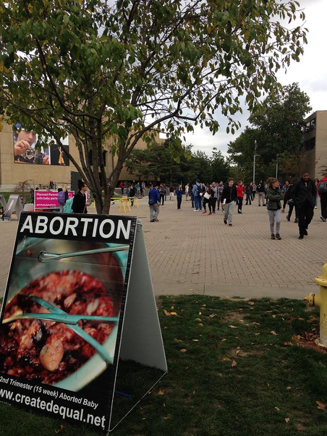 Anti-abortion activists stationed outside of Bierce Library. 