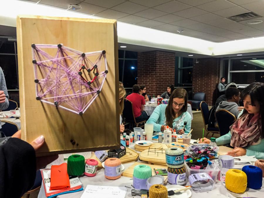 Students make the state of Ohio out of string for ZPNs art series. 