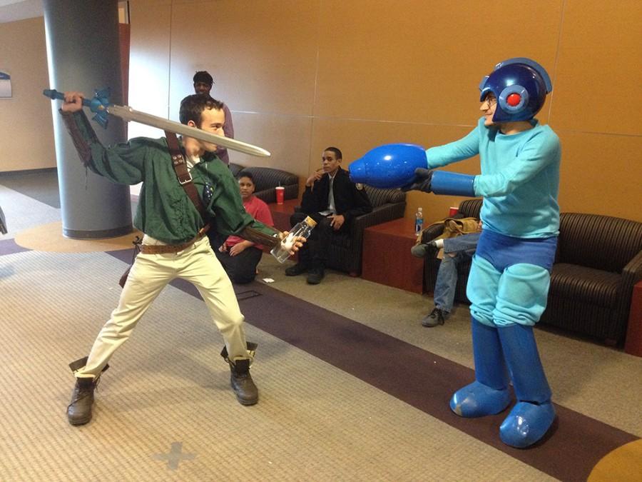 Attendees cosplay as Link (left) and Mega Man (right) in the Student Union.