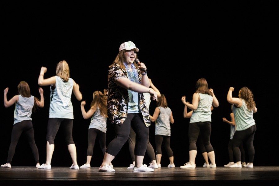 Ashley Trunik, a nursing major, raps Welcome to Miami during Alpha Phis Florida-themed Songfest performance.
