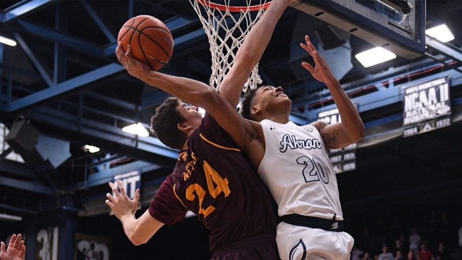 Zips+Freshman+guard%2C+Eric+Parrish+20+going+up+against+the+Chippewas.+%28Photo+courtesy+of+Akron+Mens+Basketball%29