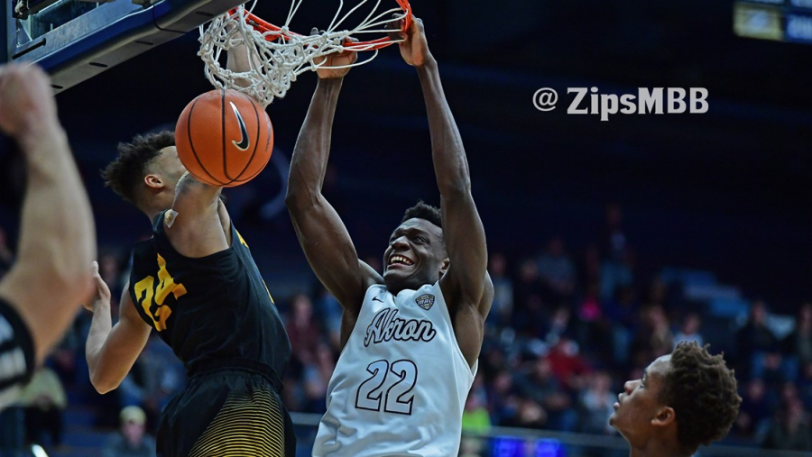 No. 22, Emmanuel Olojakpoke, slams home a dunk on Dec. 9 against Appalachian State, a little over a month before undergoing successful open-heart surgery. (Photo courtesy of Zips Mens Basketball)
