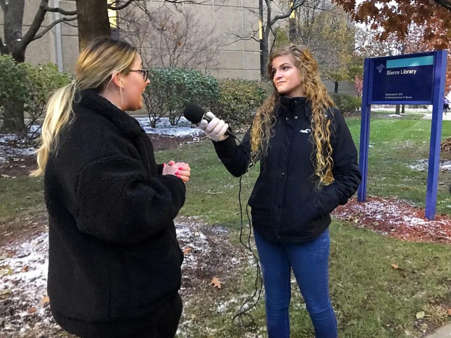 With a microphone in hand, Kaitlin Bennett engages in discourse with UA student.