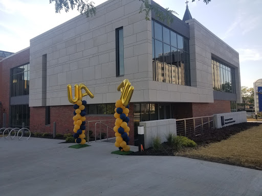 UA balloons made the celebration of the opening of the new Anthony J. Alexander Professional Development Center hard to miss.