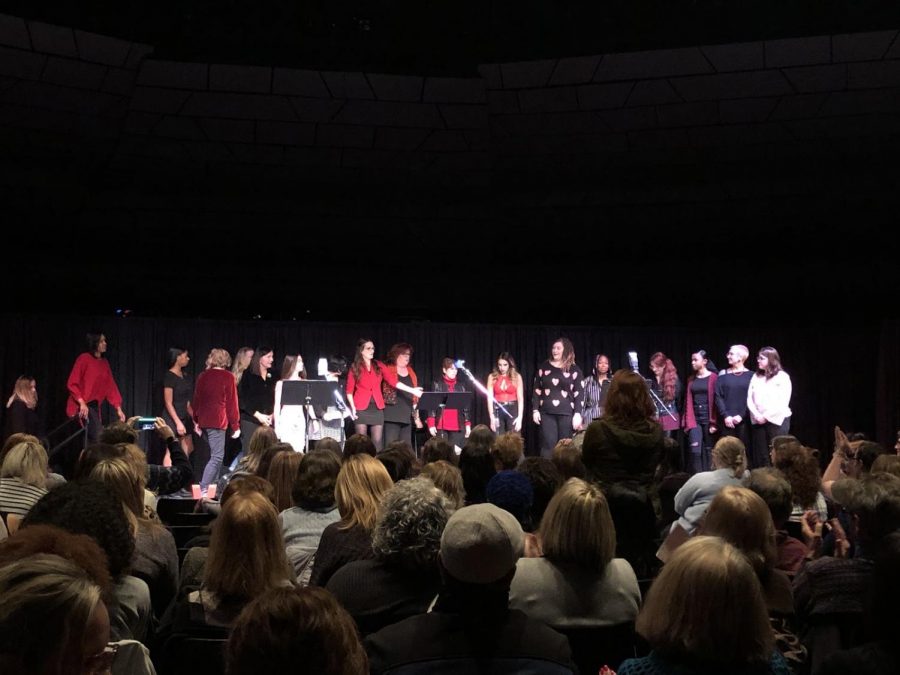 The cast of UA students, faculty and staff, as well as Akron community members, on stage.