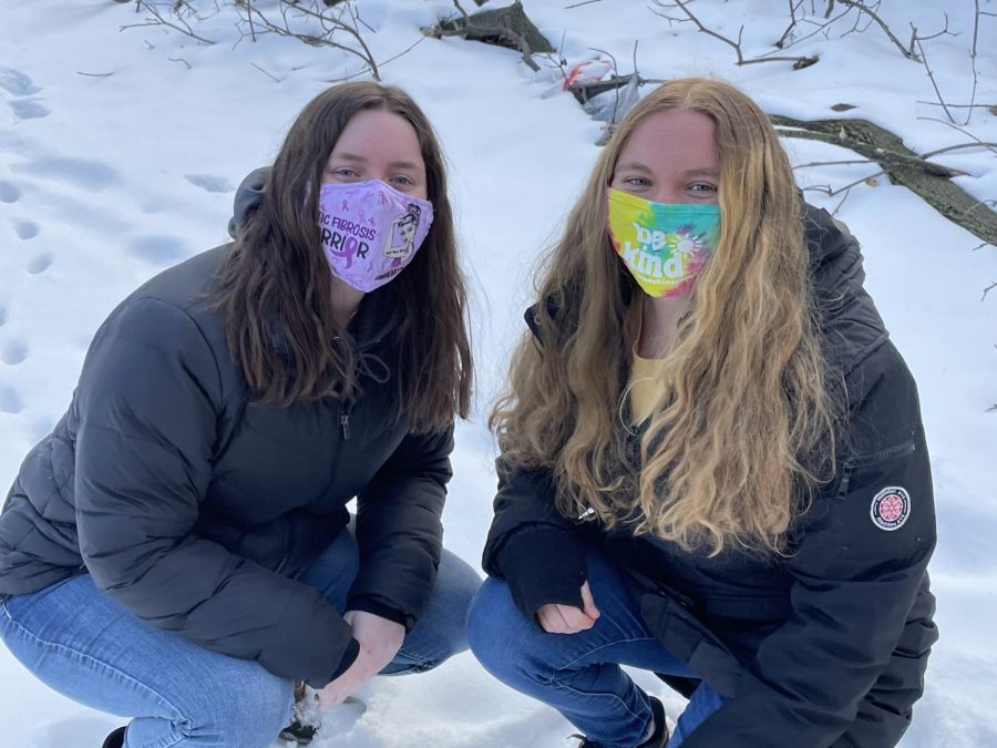 Third-year engineering UA student, Madi Britton, wears a mask advocating for Cystic Fibrosis with her roommate, Tina Grassi.