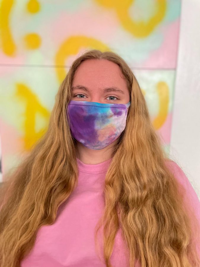 Third-year University of Akron engineering student, Tina Grassi, models a one-of-a-kind tie-dye mask