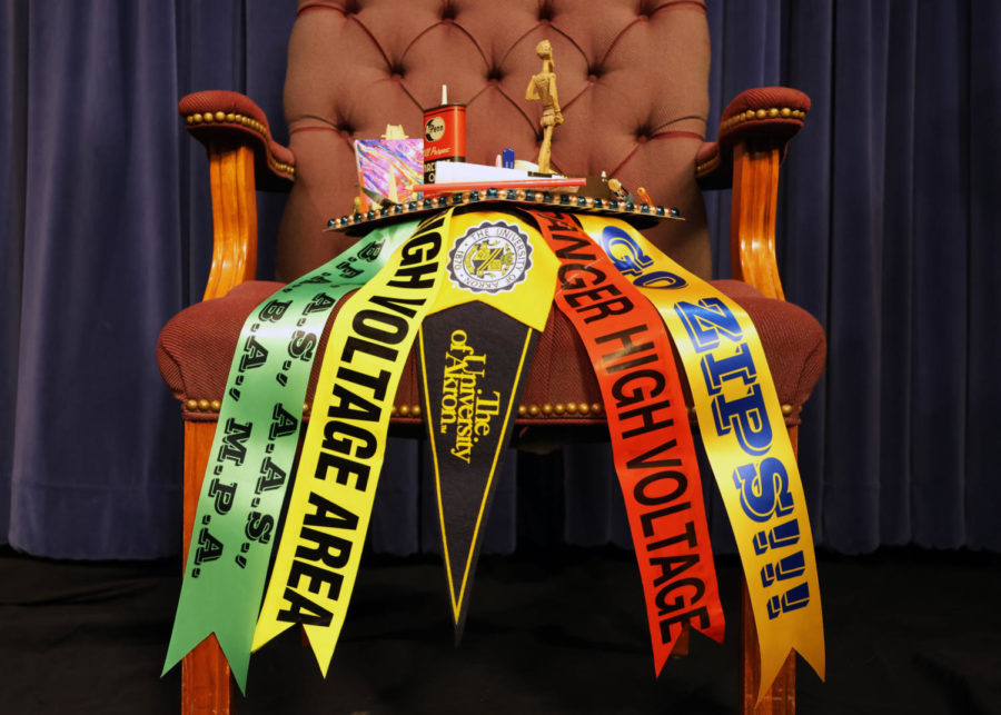Side perspective of decorated graduation cap on chair