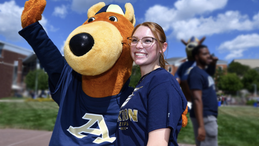 A student is with our mascot, Zippy the Kangaroo.