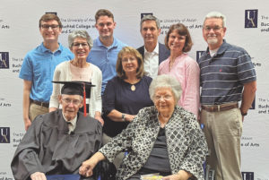 Robert Greathouse with his wife and some of his children and grandchildren after receiving his diploma.
