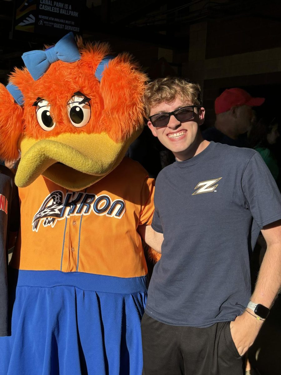 Whitten with Akron RubberDuck's mascot. 